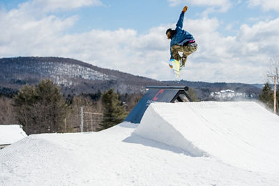 Snowboarder Hits Jump at Carinthia Terrain Park at Mount Snow