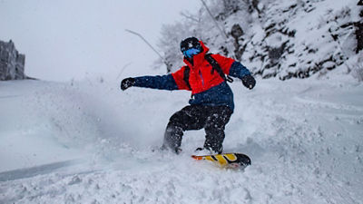 Snowboarder Rides Downhill at Hunter Mountain