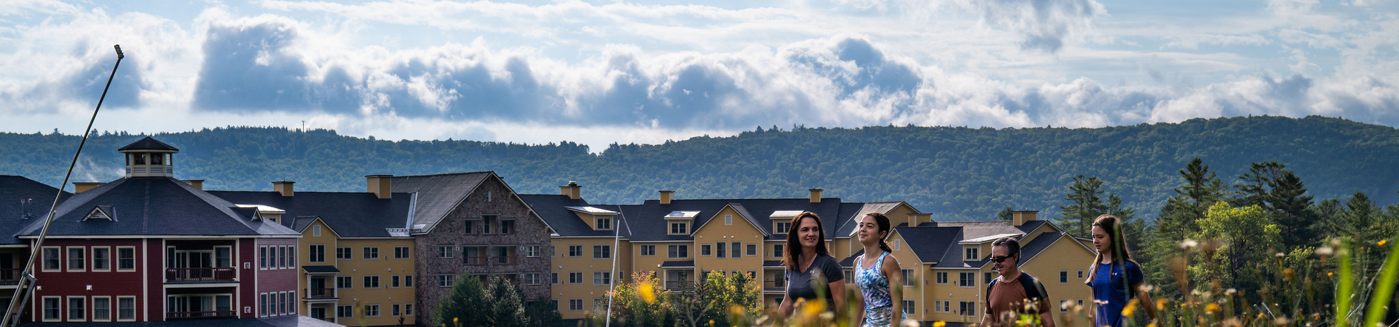 Family Hiking Outside a Jackson Gore Inn at Okemo During Summer